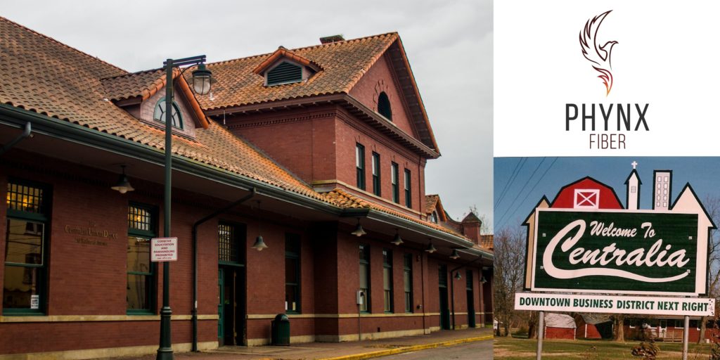 Photo Credit: Chronline News website Centralia train depot, large red brick building with Spanish sytle roof tiles & green lamp post, green doors and windows. Centralia welcome sign pointing to Downtown Buisness district next right for Centralia Missouri 